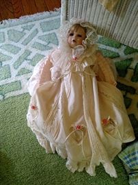 Boehm porcelain baby doll in original basket and clothing