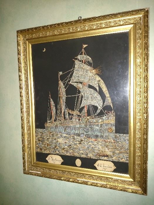 This is artwork of a ship of sea made entirely with Reichspost postage stamps dating in the 1890's