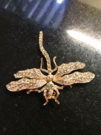 pin  with  ruby  eyes 