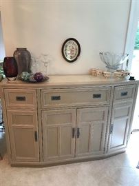 Buffet cabinet displaying decorative items