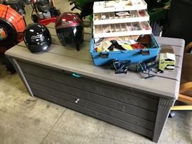 Helmets, fishing tackle box and storage bench