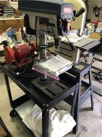 Ryobi drill press (bench height) and grinder behind it