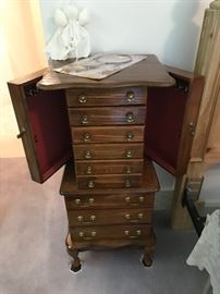 Floor standing jewelry chest.