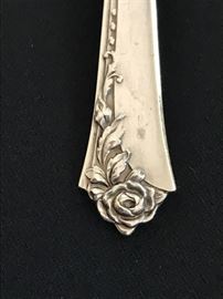 Detail of Sterling flatware set, "Damask Rose".