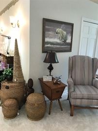 Grouping of large baskets, storage/table, wingback chair. Painting is by listed wildlife artist, Dennis P. Anderson (1940 -2005)