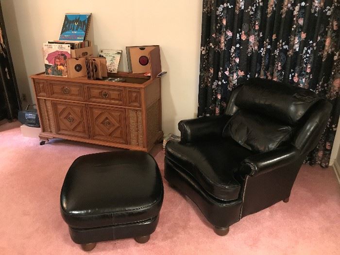Black Leather Chair and Ottoman/Hassock.   Magnavox Stereo Console works with record Player.  Record Albums