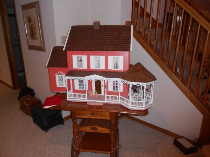 large dollhouse and miniature furnishings