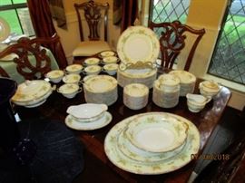 This beautiful set of Noritake Japan dishes is very only.  Beautiful blue trim around edge compliments the pattern.  Also., cups are two handled....referred to as Boullion cups.  
