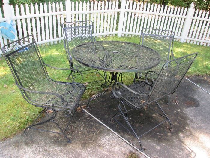 Outdoor Wrought Iron Round Table w Four Chairs - has umbrella hole