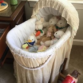 Bassinet complete with stuffed friends.