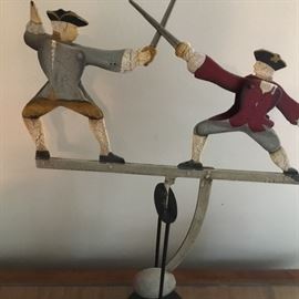 Dueling fencers bobble toy. There’s a u tube video of them fencing.