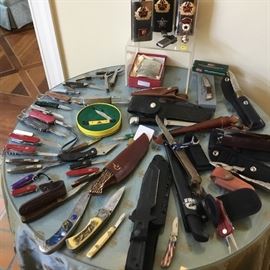 Knives of all shapes and sizes along with a couple of Soviet era flasks.
