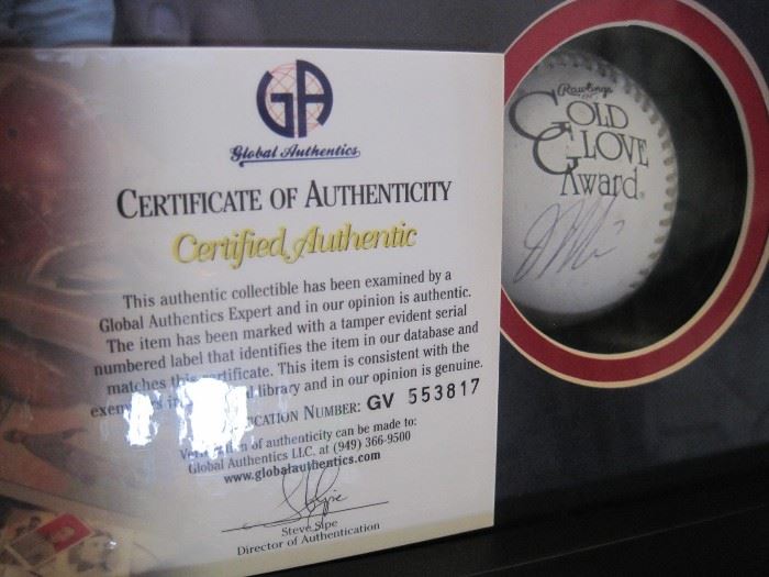 Joe Mauer signed Golden Glove Ball with photograph and certificate.