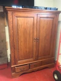 #40 oak entertainment center w 2 doors 51x27x67 $125.00