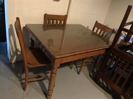 #78 oak table (adjustable height) and 3 chairs with glass top 42x34x28 $175.00