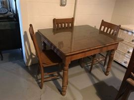 #78 oak table (adjustable height) and 3 chairs with glass top 42x34x28 $175.00