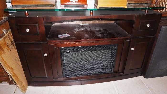 Entertainment center with electric fireplace and thick glass top