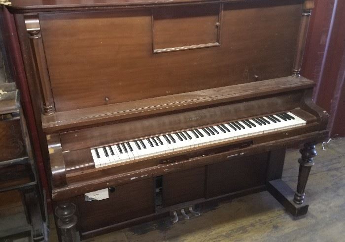 Kimball player piano with extra rolls