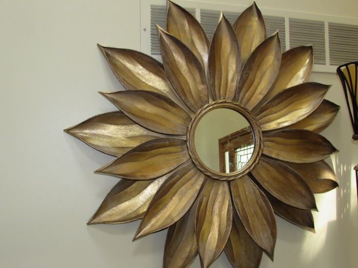 LARGE LOVELY CONVEX MIRROR SURROUNDED BY TEXTURED GOLDEN METAL PETALS