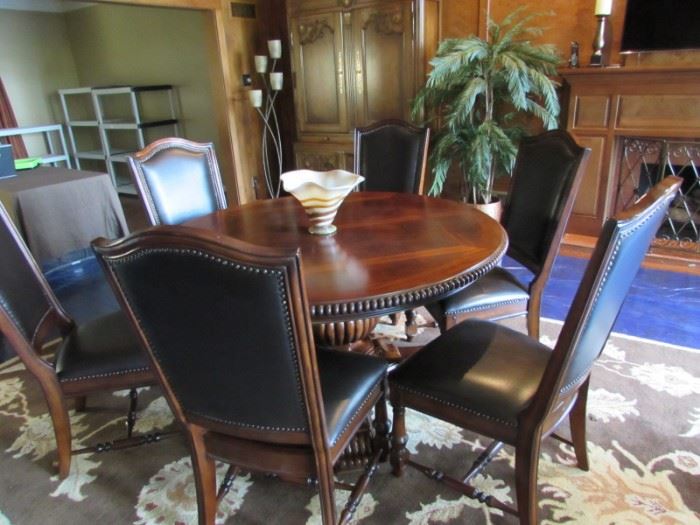 BURNISHED BROWN FINISH DINING TABLE WITH LOVELY BEADED DETAIL & 6 NAILHEAD TRIM CHAIRS .  DINING TABLE HAS UNIQUE "BUTTERFLY LEAVES", EXPANDING THE TABLE FROM THE OUTER RIM, WHILE KEEPING THE TABLE TO THE TRUE ROUND SHAPE!