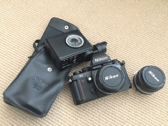 Nikon F3 with case and lots of parts! Original manual inside too! This is a film camera that is selling like hot cakes on ebay...excellent