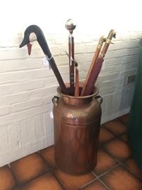 Copper Milk Urn filled with carved canes