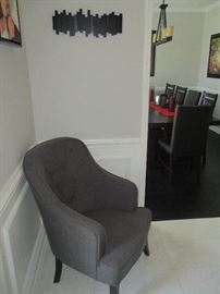 Grey fabric chair with wall piece