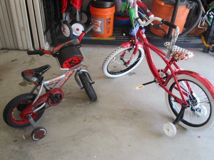 2 well kept children's bicycles with training wheels