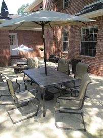 Tile top outdoor table with 6 chairs and umbrella