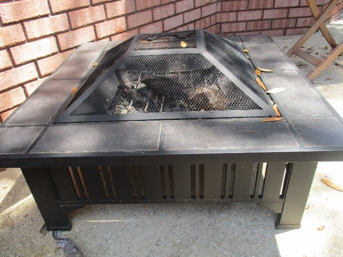 Well kept fire pit with cover