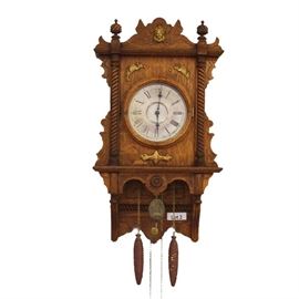 Early 20th Century Oak Waterbury Wall Clock. 8 Day Time and Strike. 30" tall. 
