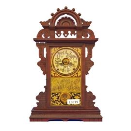 Lot 19 - Turn of the Century American Walnut "Eclipse" Shelf Clock, unmarked. 8 Day time and strike. 24 1/2" tall.