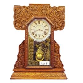 Lot 31 - Turn of the Century Oak Gingerbread Shelf Clock. 8 Day time and strike. 20" tall.