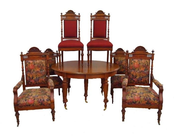 Victorian Table & Chairs - Dining set features an oval table in walnut with four 9" extension leaves and six upholstered chairs.