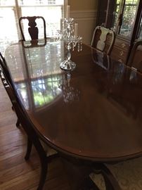 Dining room table. Measures about: 84" long, 44" wide, 29" high. one additional leaf 18" wide. Candle holder is for sale