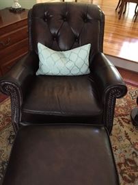 Pair of leather chairs - one with ottoman