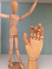Artist drawing model hand and mannequin