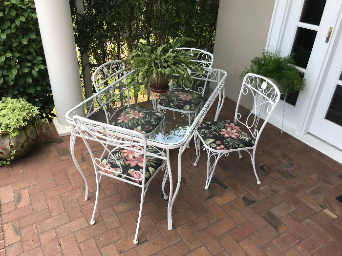 Wrought iron and glass patio table and chairs