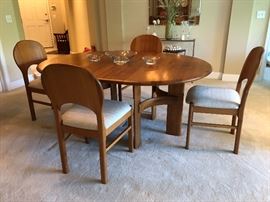 Ansager Mobler solid teak dining set. Comes with 6 dining chairs & two leaves. Extends from a 47” circle(not photographed) to 87” long