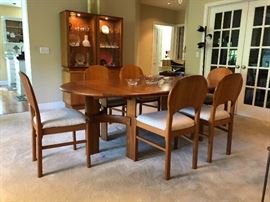 Ansager Mobler solid teak dining set. Comes with 6 dining chairs & two leaves. Extends from a 47” circle(not photographed) to 87” long