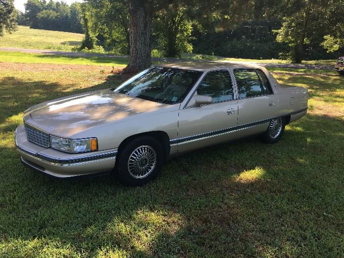 GOLD 1994 CADILLAC SEDAN DEVILLE.  AIR BLOWS COLD AND READY TO ROLL!  PLEASE NOTE THAT THERE IS SOME MINOR SHEET METAL DAMAGE TO THE RIGHT FRONT DOOR - PRICED ACCORDINGLY