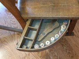Opened drawer of the sewing rocker