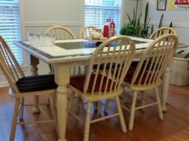 Ceramic tile top dining table with six chairs