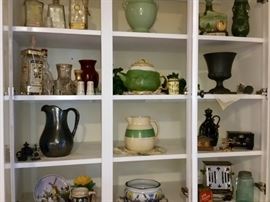 Owner's collection of antique and vintage vases, pitchers, decanters, and more