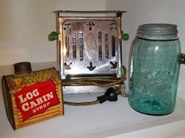 In the center is a vintage art deco era toaster