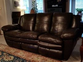 Dark brown Italian leather sofa with built-in recliners at each end
