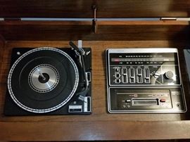 Zenith console stereo has phono, AM/FM stereo, and 8-track player/recorder. Everything works.