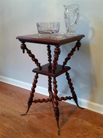 Merklen Brothers antique mahogany lamp table with brass feet