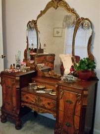 This depression era ornate vanity matches the dresser