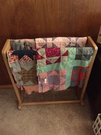 Several more quilt tops ready to be quilting along with multiple quilt racks!